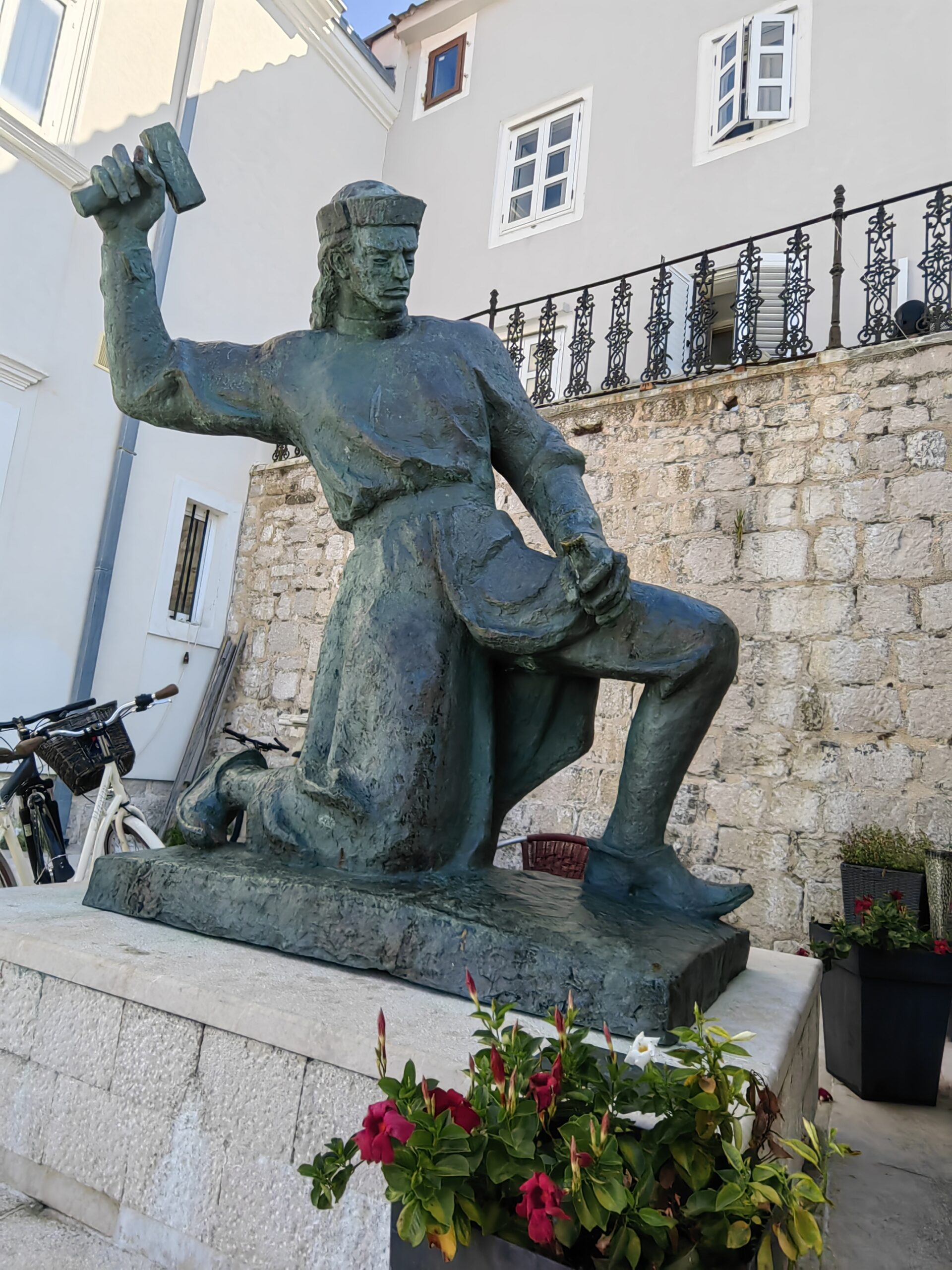 Statue of Juraj Dalmatinac in the historic centre of Pag, Croatia