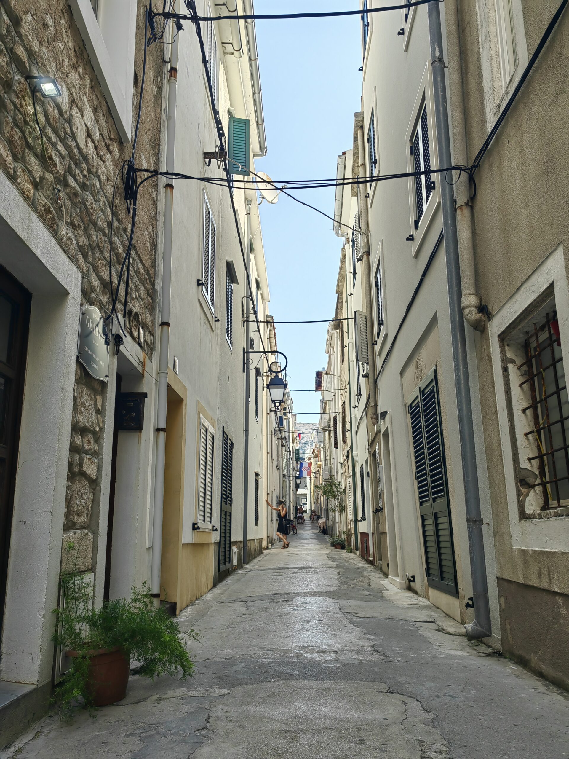 Narrow historic stone street in the old town of Pag, Croatia