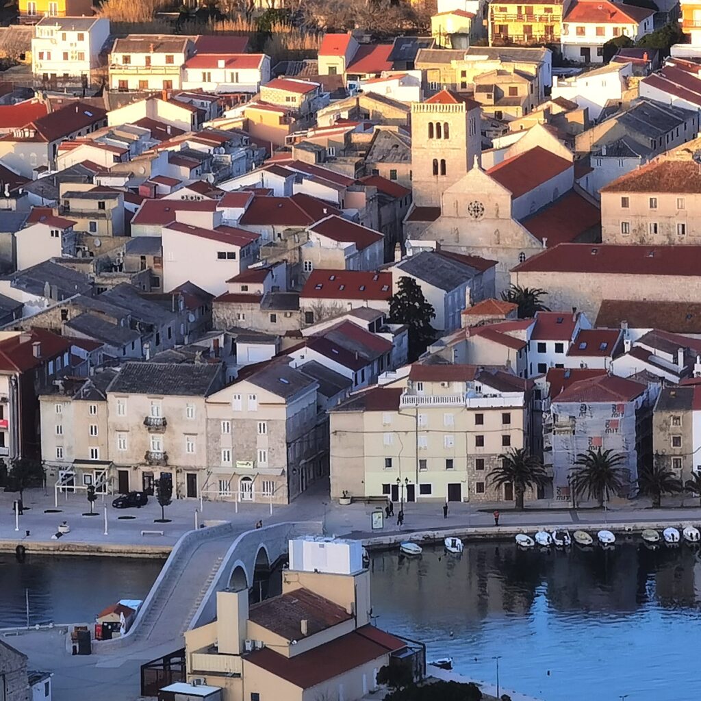 View of Pag Old Town, the Town Bridge and St Mary’s Church in Pag, Croatia