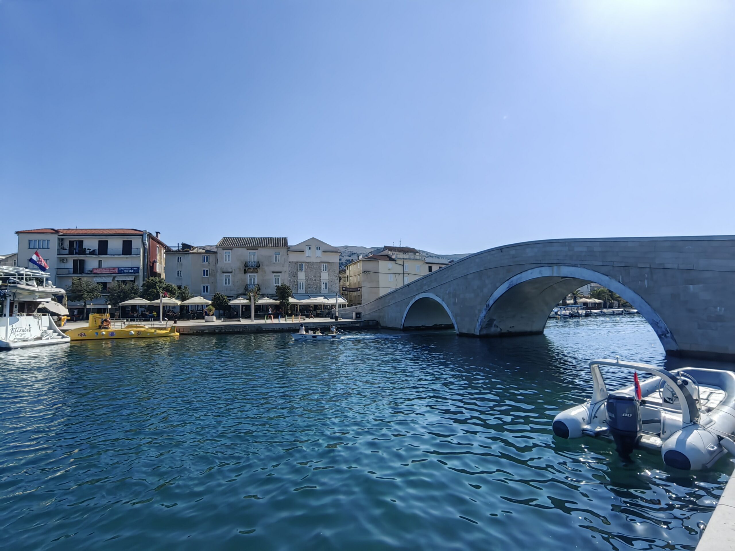 Stone bridge across the waterfront in the town of Pag, Croatia